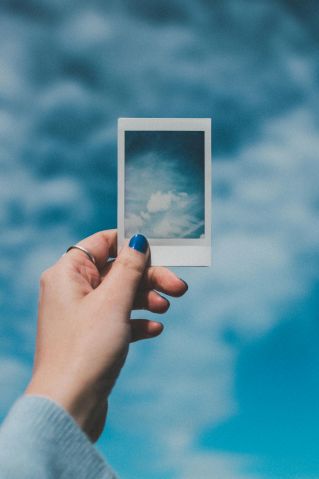 Person Holding Cloud Photo